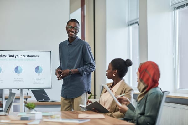 A man is giving a presentation in a conference room