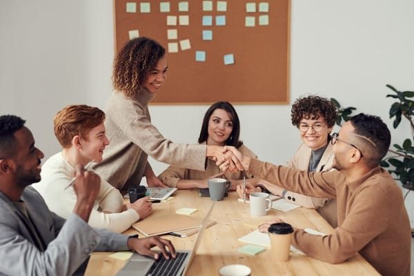 A diverse group of colleagues having a meeting at a conference table