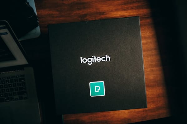 The image depicts a large black box with the 'Logitech' logo prominently displayed on the top